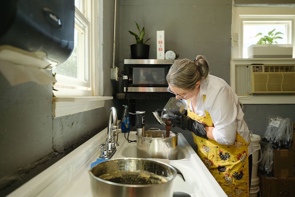 Rural 1st customer, Suzanne Harper, mixes soap on her rural Tennessee property.
