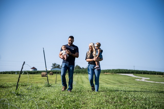 Brewer family walking on farm